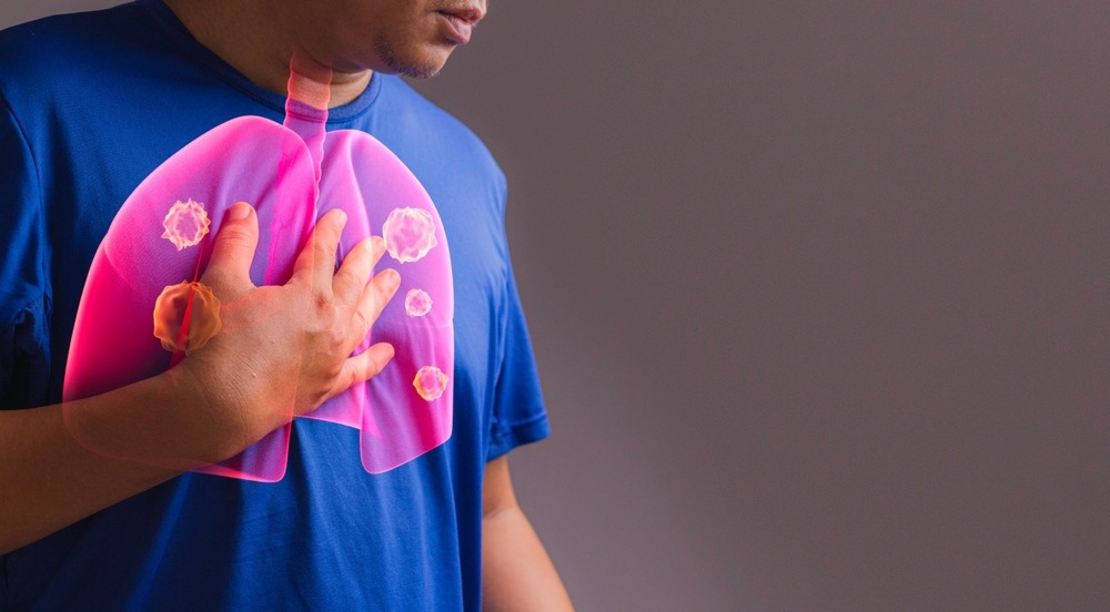 a man holding his chest with a diagram of a chest infection