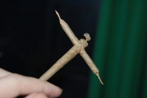 hand holding a cross joint