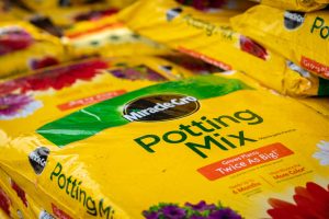 a stack of miracle gro soil