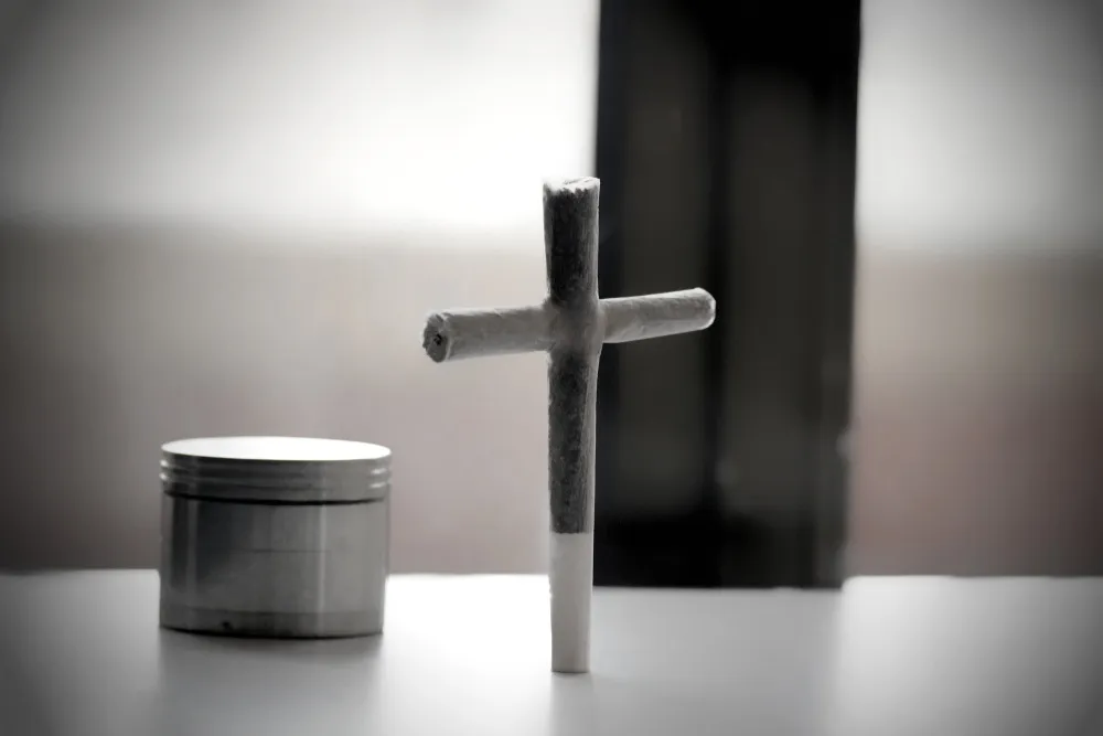 a cross joint next to a grinder on a white table