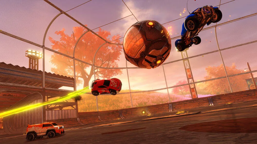an in-game shot of rocket league with 3 cars and 1 soccer ball on a soccer field with little balls of boost in the background