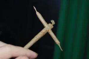 hand holding a cross joint